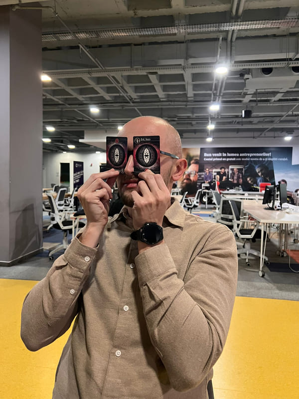 A player holding two Ritual Cards up in front of their eyes like spectacles